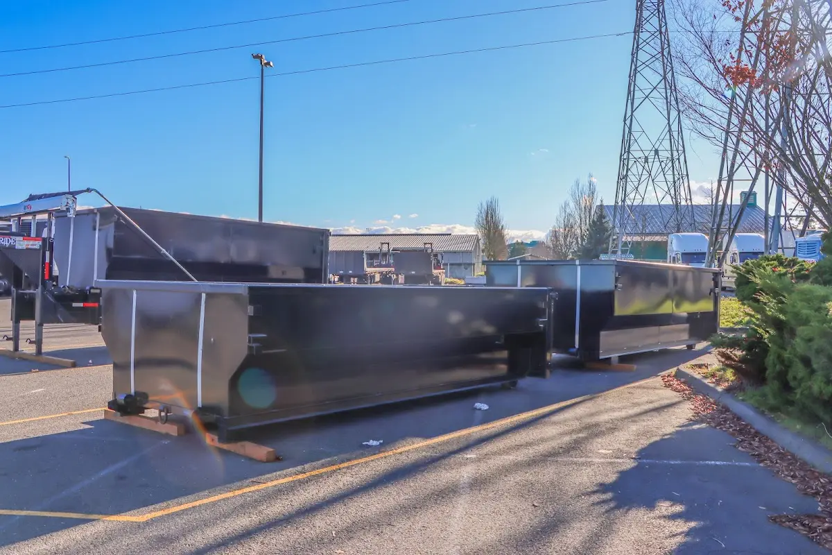 Roll-off dumpster ready for waste disposal at job site for Concrete Dumpster Rental in Wilkes-Barre